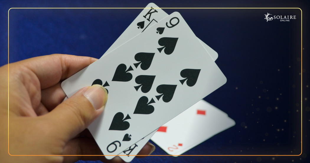 How To Play Baccarat - A Hand With A Pair Of Cards
