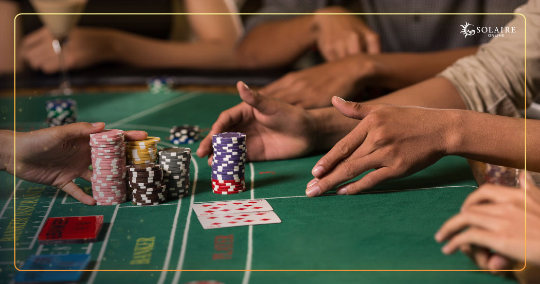 How To Play Baccarat - Players Placing Their Bets