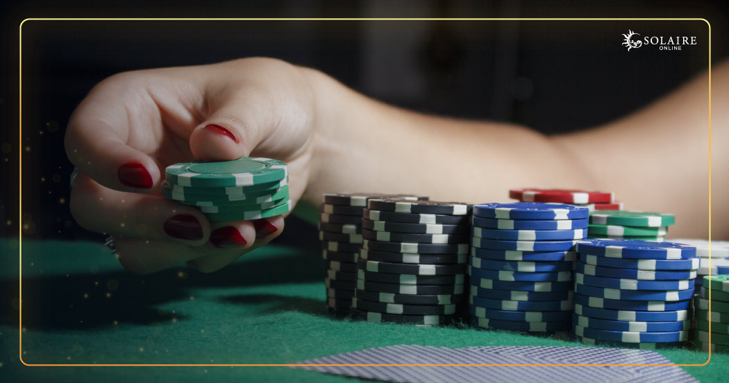 How To Win Baccarat - A Hand Holding Two Poker Chips