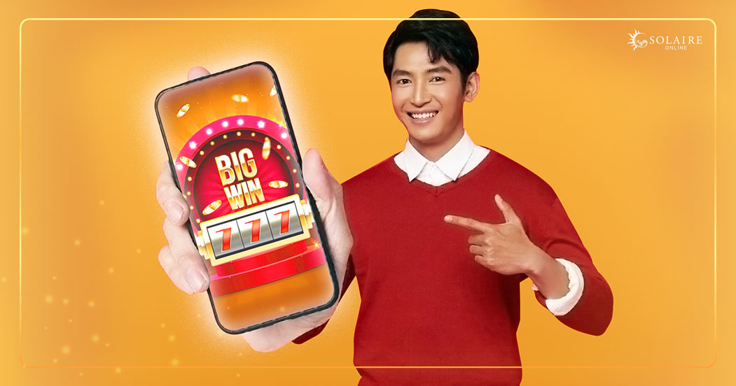  Solaire in Your Pocket The Future of Online Gaming - A Man Pointing On His Phone Flashing Win Big On The Screen