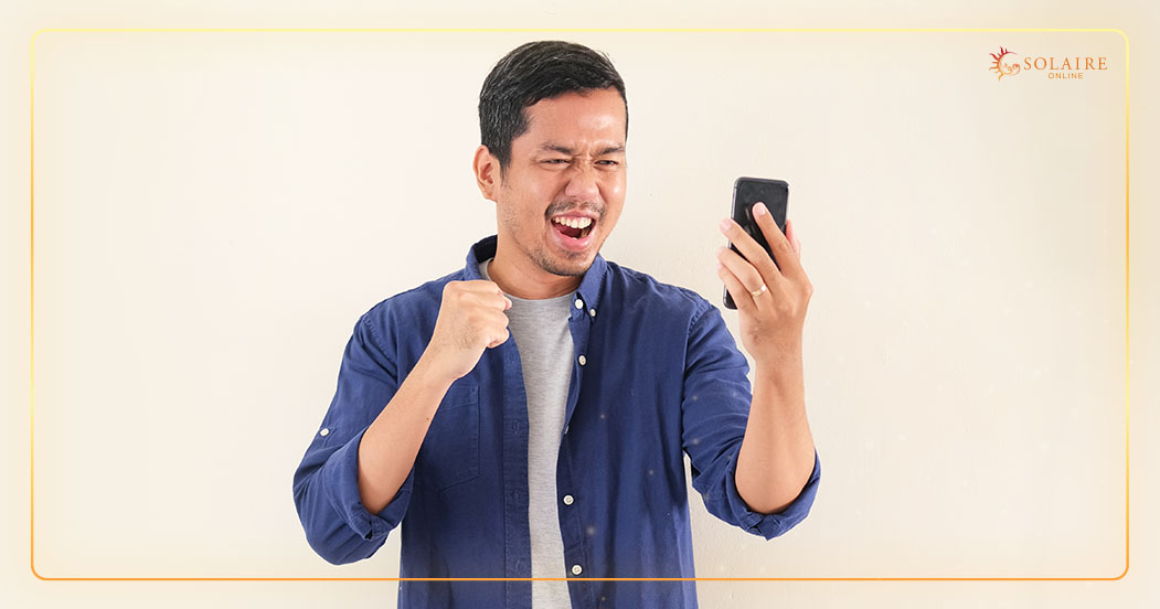 Solaire in Your Pocket The Future of Online Gaming - A Man Winning The Online Casino Jackpot On His Phone