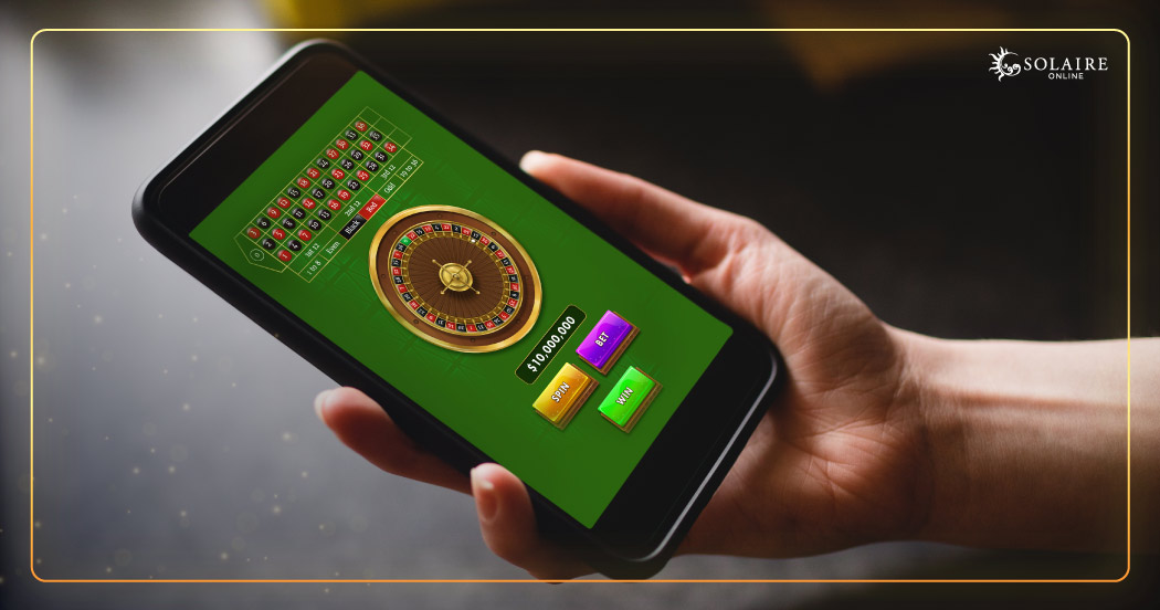 What Is Live Casino - A Hand Holding Smartphone Playing Online Roulette
