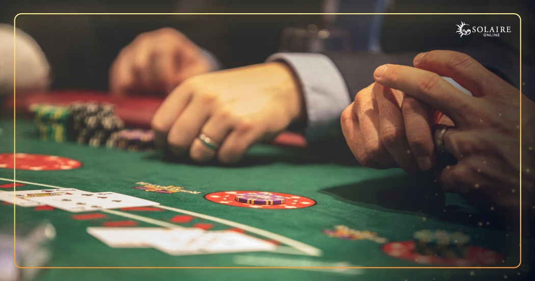 What Is Live Casino - Players Placing Their Bets On Baccarat Table
